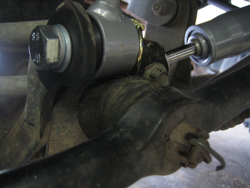 Close-up of suspension components with a silver shock absorber