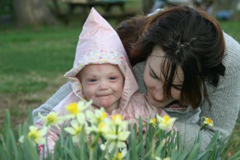 2003 Jeep TJ - A mother and her baby are in a garden with daffodils in the foreground.
