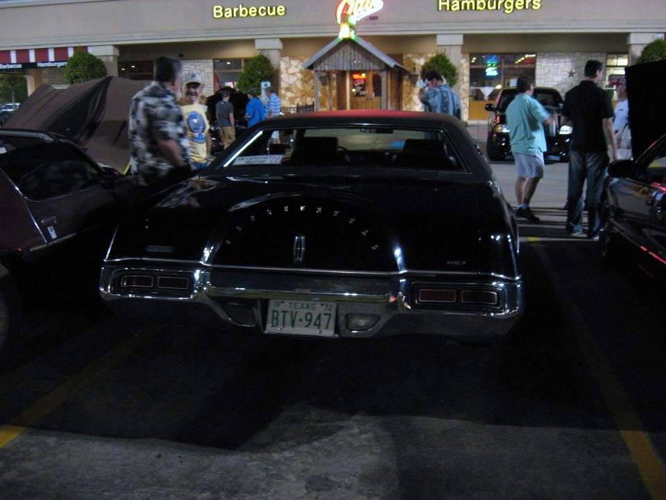 Black 1972 Lincoln Continental Mark IV rear view with Texas license plate BTV-947