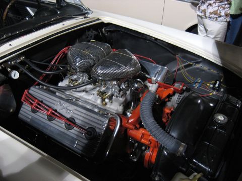 2000 Ford Crown Victoria - Close-up of a V8 engine in an engine bay, dual carburetors and custom valve covers.