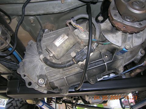1996 Ford Bronco - Underside view of vehicle's transfer case and transmission assembly.