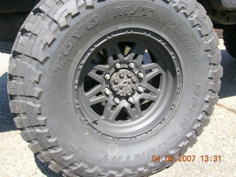 1996 Ford Bronco - This image shows a close-up of a off-road tire and wheel assembly, not a specific vehicle model year.