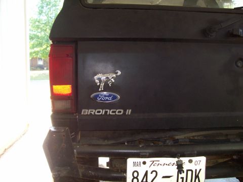 1989 Ford Bronco II - Close-up of the rear of a Ford Bronco II, showing the emblem and taillight.