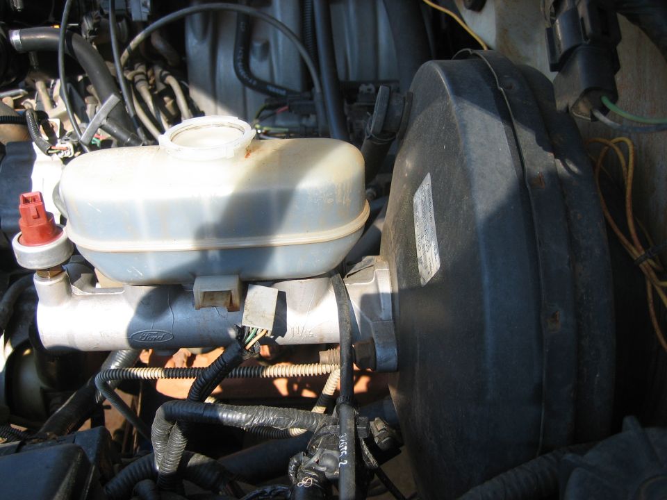 Ford brake master cylinder, reservoir and booster in an engine bay