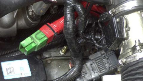 1997 Ford Taurus - Close-up of engine wiring harness and connectors, with visible text from Supermotors.net.