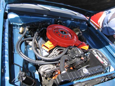1991 Ford LTD Crown Victoria - Engine bay details of a classic blue car, a prominent red air cleaner.