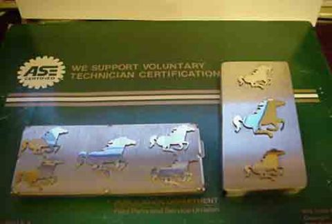 1993 Ford Bronco - These emblems, likely for a Ford Mustang, are displayed on a document about technician certification.