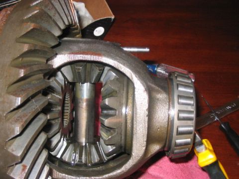1991 Ford Bronco - Close-up of differential gears and a bearing race, with tools nearby.