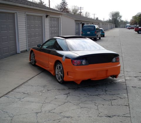 1995 Ford Probe - This two-tone sports car features an aggressive rear bumper and side skirts.