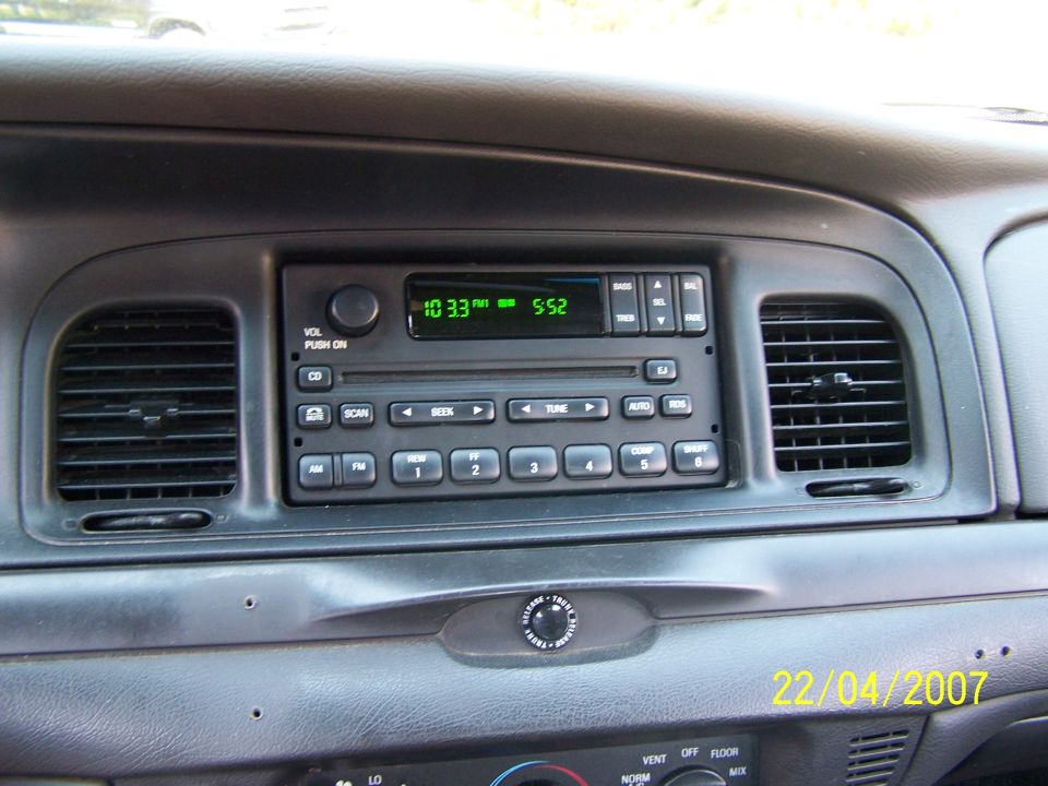 Dashboard of a car showing the radio and air vents. Date stamp says 22/04/2007
