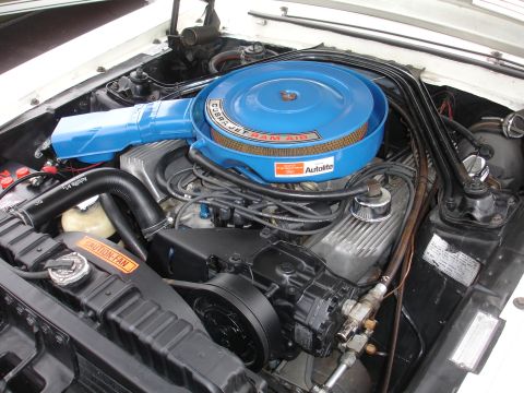1993 Ford Taurus - Close-up of a blue Cobra Jet Ram Air cleaner assembly atop a V8 engine, with visible Autolite branding.