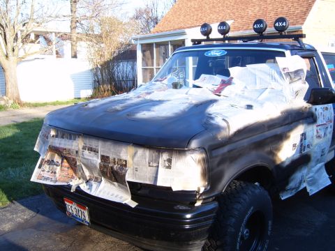 1993 Ford Bronco - This Ford truck is being prepped for a paint job, with newspaper covering the windshield and hood.