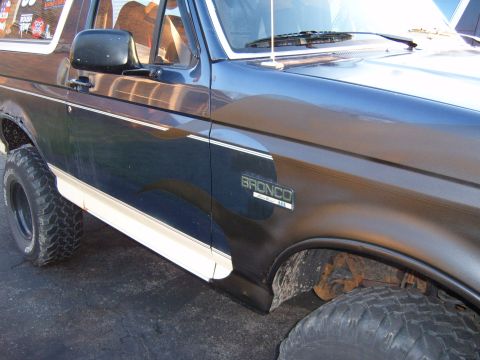 1993 Ford Bronco - Side view of a 1993 Ford Bronco, its distinctive body style and badging.