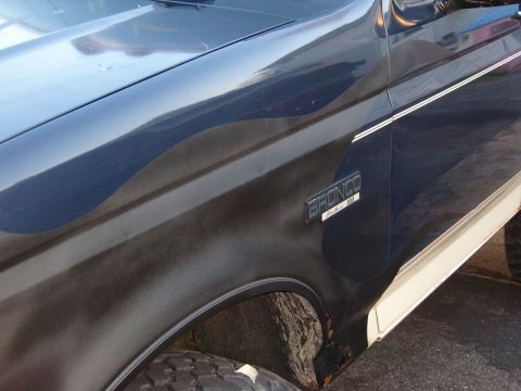 1993 Ford Bronco - The 'BRONCO' badge is clearly visible on the side fender of this vehicle.