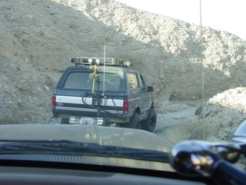 1994 Ford Bronco - A Ford Bronco navigates a rocky, off-road trail.