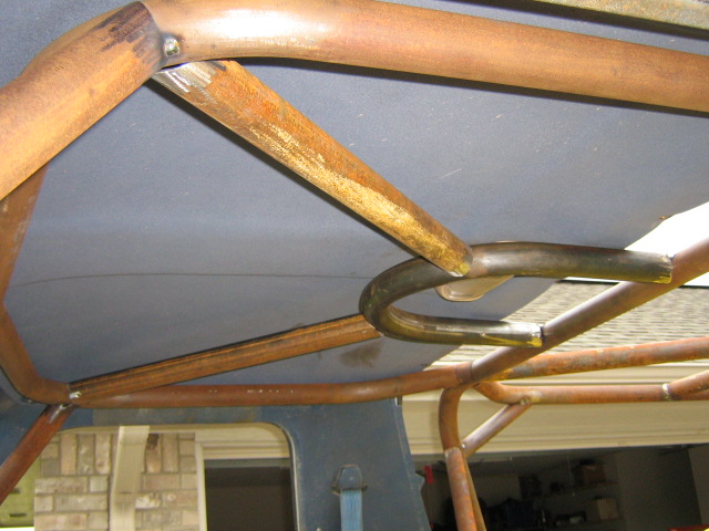 Roll cage tubing installed inside a vehicle's interior