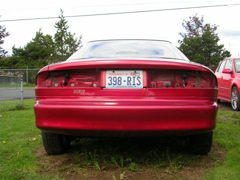 1996 Ford Probe - Rear view of a 1996 Ford Probe with missing taillights and a Washington license plate.