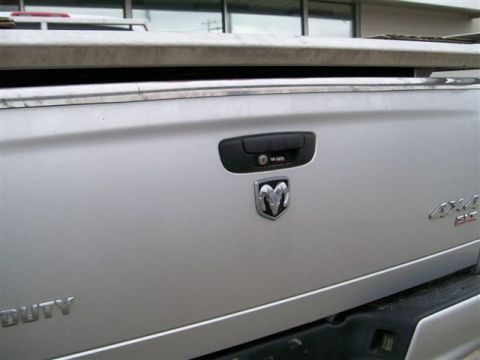 2005 Dodge 3500 - Rear view of a 2005 Dodge 3500 pickup truck's tailgate with Ram emblem and 4x4 badging.