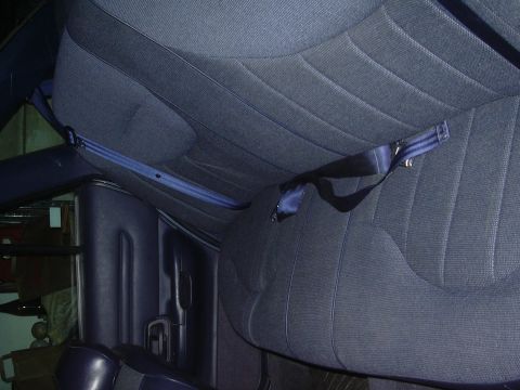 1996 Ford Crown Victoria - Interior view of a car's rear seats and seatbelts.