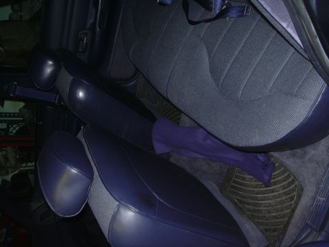 1996 Ford Crown Victoria - Interior view of dark blue cloth seats with dark blue vinyl trim and seatbelts.