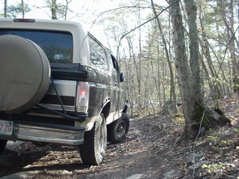 1993 Ford Bronco - This Ford Bronco is seen from the rear on a wooded trail.