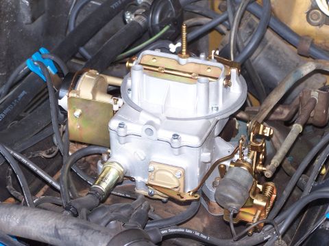 1973 Ford Ranchero - Close-up view of a carburetor assembly with associated engine components.