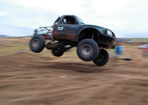 1992 Ford Explorer - This modified truck is captured mid-air during an off-road race event.