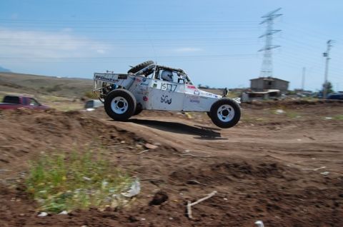 1992 Ford Explorer - This off-road buggy is captured mid-air during a race, its suspension and off-road capabilities.