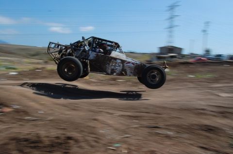 1992 Ford Explorer - A custom-built off-road buggy is captured mid-flight during a race or stunt.