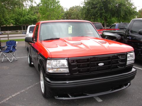 1993 Ford Taurus - Customized 1993 Ford F-150 SVT Lightning truck with aftermarket hood scoops and grille.