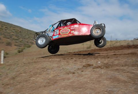 1992 Ford Explorer - This buggy is airborne during a race, showing its underside and suspension.