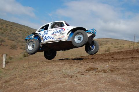 1992 Ford Explorer - Off-road buggy with number 552 takes flight during a race.