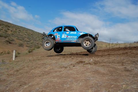 1992 Ford Explorer - This modified VW Beetle is mid-air during an off-road race event.