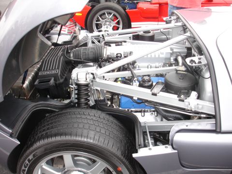 1993 Ford Taurus - Close-up of the engine compartment of a silver Ford GT, with a red Ford GT visible behind it.