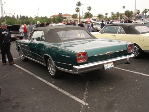 1993 Ford Taurus - This 1965 Ford Galaxie convertible is seen from the rear, a black soft top and chrome bumper.