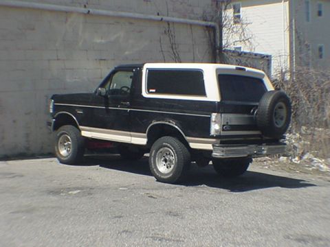 1993 Ford Bronco - This 1992 Ford Bronco is seen from a three-quarter front angle, with its spare tire visible on the back.