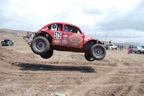 1992 Ford Explorer - Off-road race car, a modified Volkswagen Beetle, catches air during a competition.