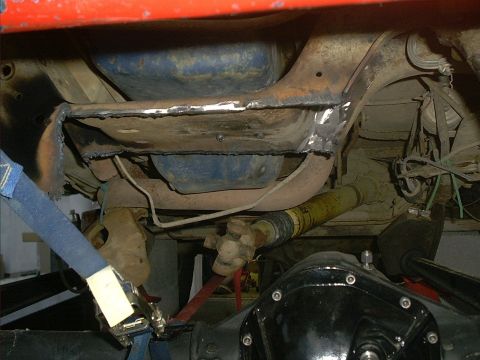 1986 Ford Bronco - Vehicle undercarriage with visible suspension and drivetrain components, showing recent welding work.