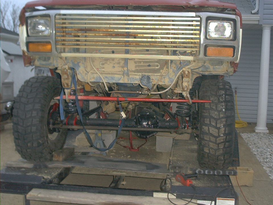 Front end of a lifted Ford Bronco with aftermarket suspension components visible