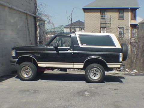 1993 Ford Bronco - This 1993 Ford Bronco is seen from the side, a two-tone paint scheme and a spare tire mounted on the rear.