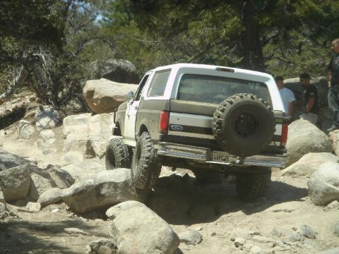 1994 Ford Bronco - Ford Bronco tackling a challenging rocky off-road path.