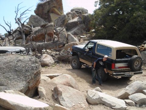 1994 Ford Bronco - Ford Bronco navigating a rocky off-road course.