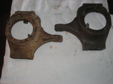 1991 Ford Bronco - Two Dana 60 front axle knuckles are shown, one heavily rusted and the other in darker metal.