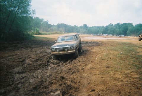 1978 Ford Bronco - Ford Bronco navigating a challenging muddy terrain.