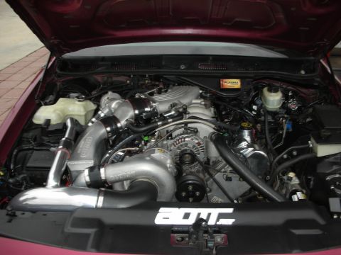 1992 Ford Crown Victoria - The engine bay shows a heavily modified V8 with twin turbochargers and custom intake plumbing.