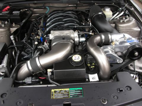1992 Ford Crown Victoria - Close-up of a modified V8 engine, a prominent supercharger and custom intake system.