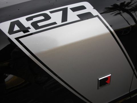 1992 Ford Crown Victoria - Close-up of a car's fender showing a '427' stripe and a Roush emblem.