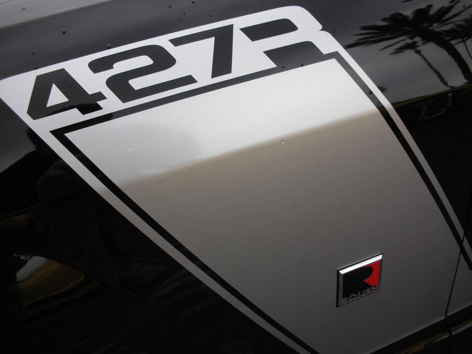 Black car fender with silver stripe and '427' graphic, plus a Roush badge