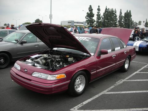 1992 Ford Crown Victoria - Maroon 1992 Ford Crown Victoria at a car show, hood open to display the engine.