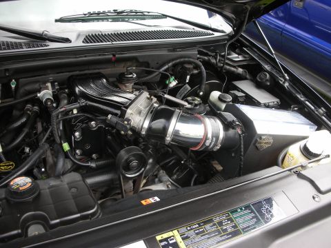 1992 Ford Crown Victoria - Close-up of a modified engine bay, a custom air intake system and a Harley-Davidson branded air cleaner housing.